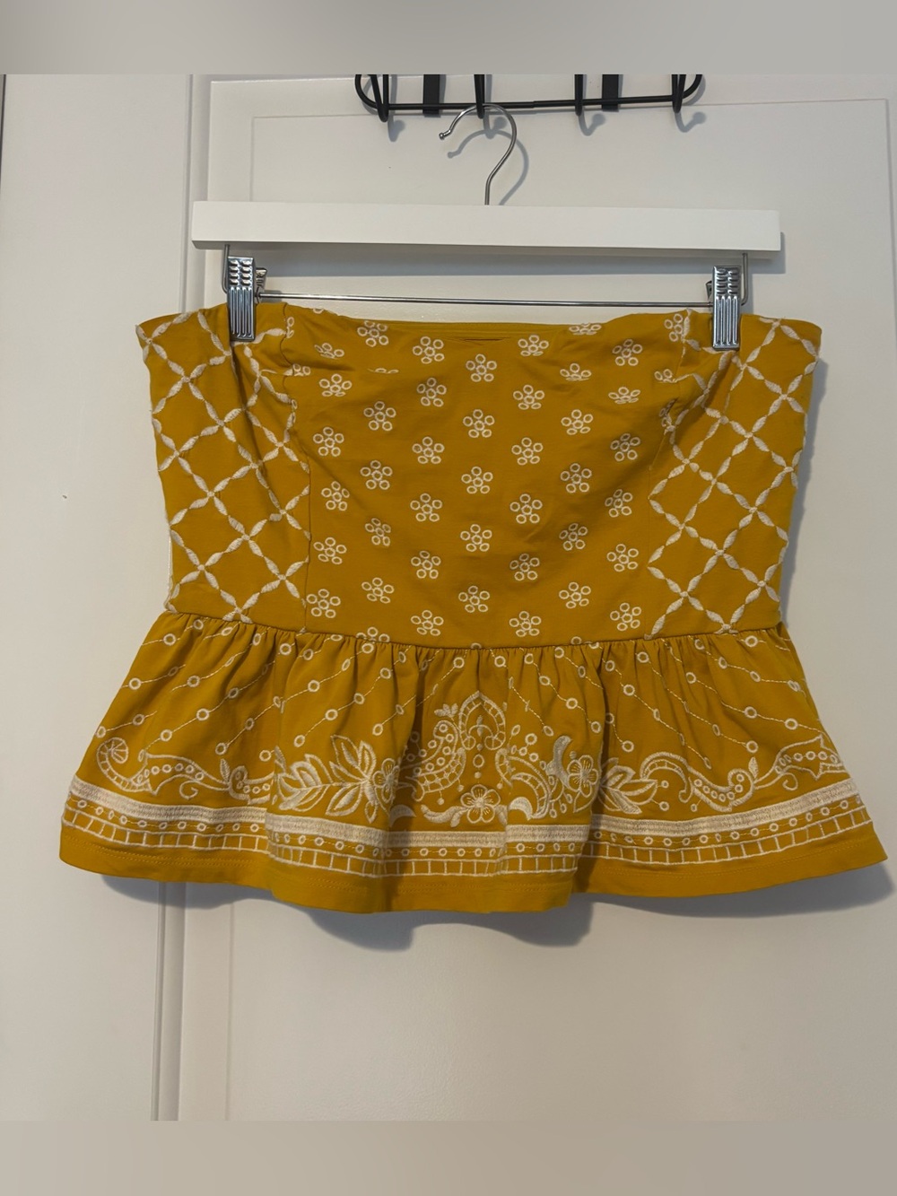 Express strapless peplum top medium mustard yellow with white embroidery